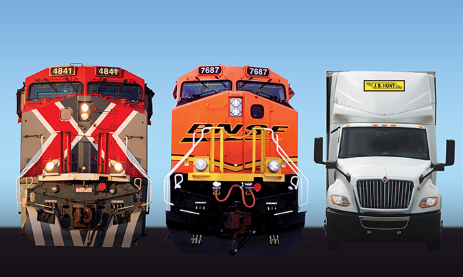 From left to right: GMXT locomotive, BNSF locomotive and J.B. Hunt truck.