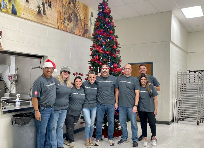 Members of the Topeka Diversity Council participate in the Topeka Rescue Mission Christmas event.